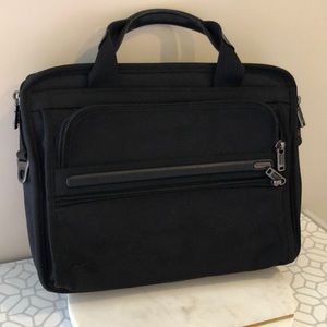 Compact TUMI computer bag.